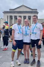 Professor Lotery, daughter Lizzie and son Chris standing in front of Southampton Guildhall wearing marathon medals