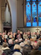 Bach's Christmas Oratorio Prof Lotery speaking to packed concert audience