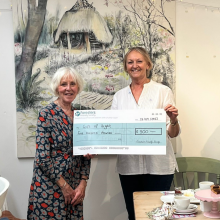 Jane presenting Ailsa with a large cheque 