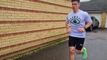 Michael running in a Gift of Sight t-shirt 
