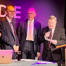 Professor Andrew Lotery, Stuart Hill and David Chalmers at presentation stand