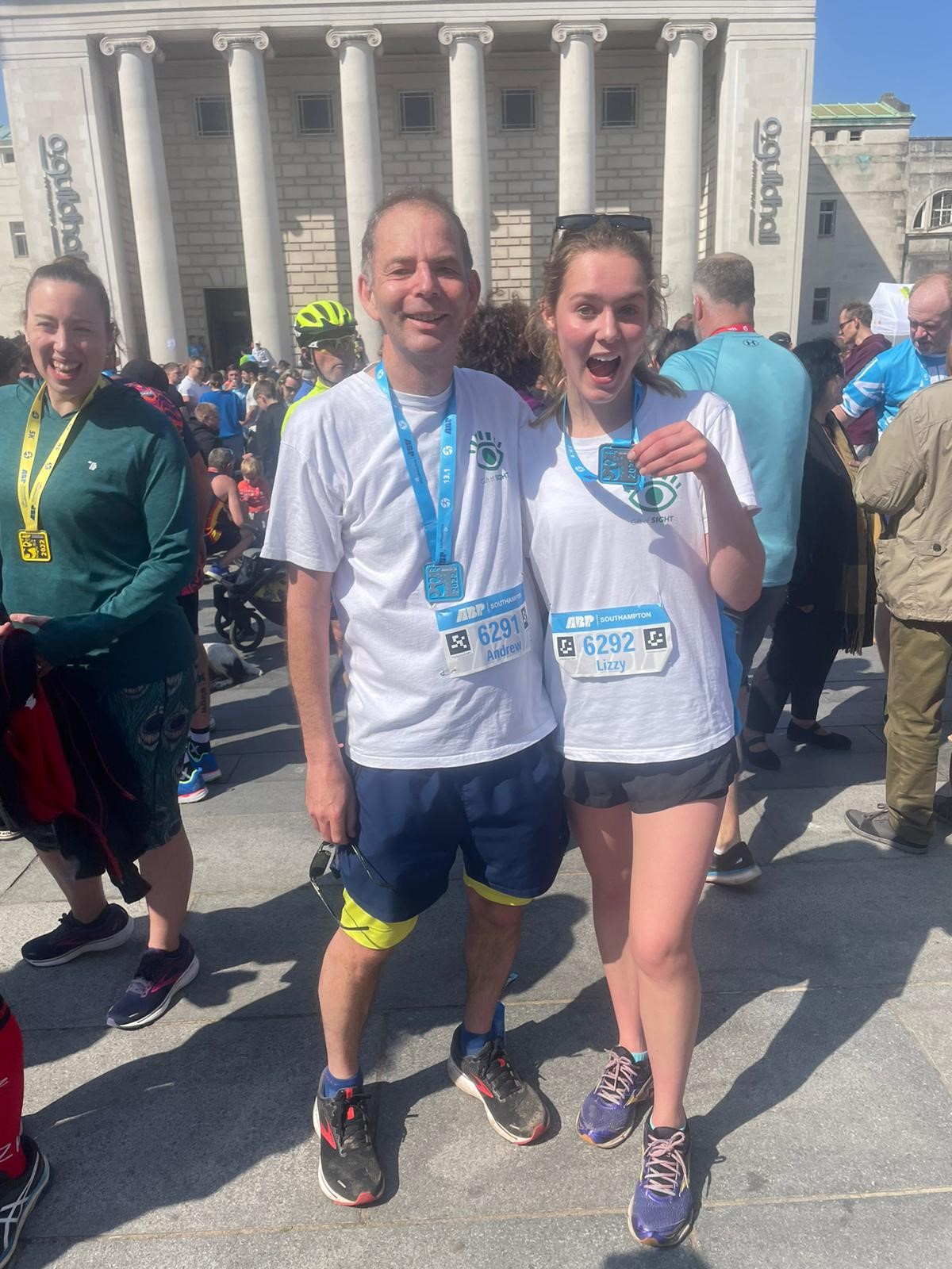 Professor Lotery and daughter Lizzy with ABP Southampton medals Picture of Prof Lotery and daughter in white t-shirt and blue shorts smiling and holding medal.