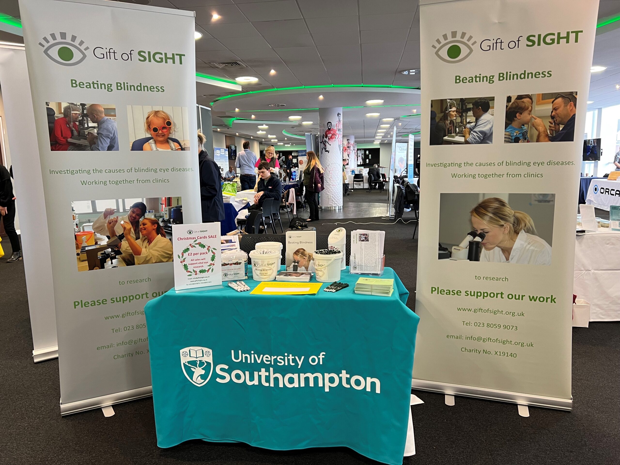 Open Sight Exhibition stand Exhibition stand showing two roll up banners and a display desk for Gift of Sight