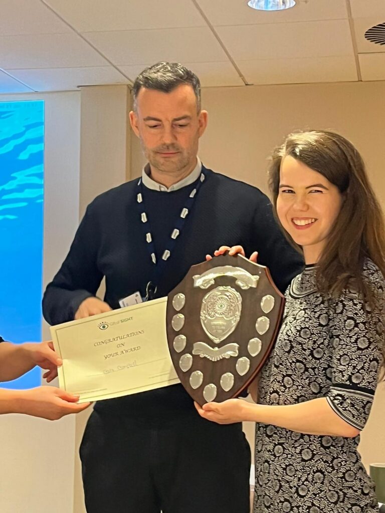 Cara campbell receiving award from Jay Self